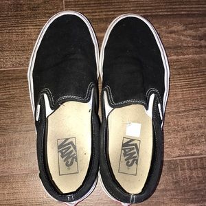 Black and white slip on vans.